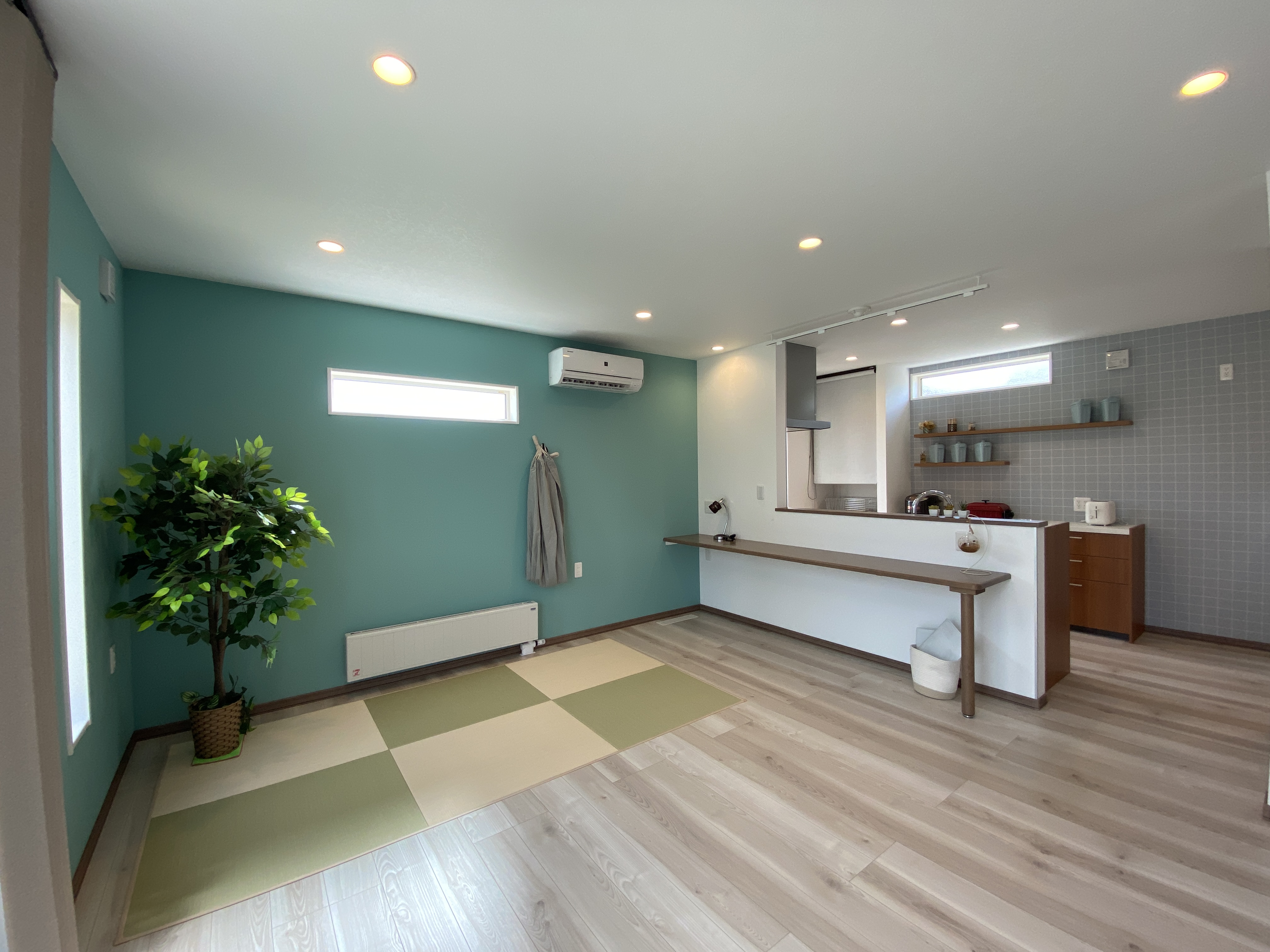 ハンモックとグリーンクロスが彩る、家事ラク動線の快適な住まい